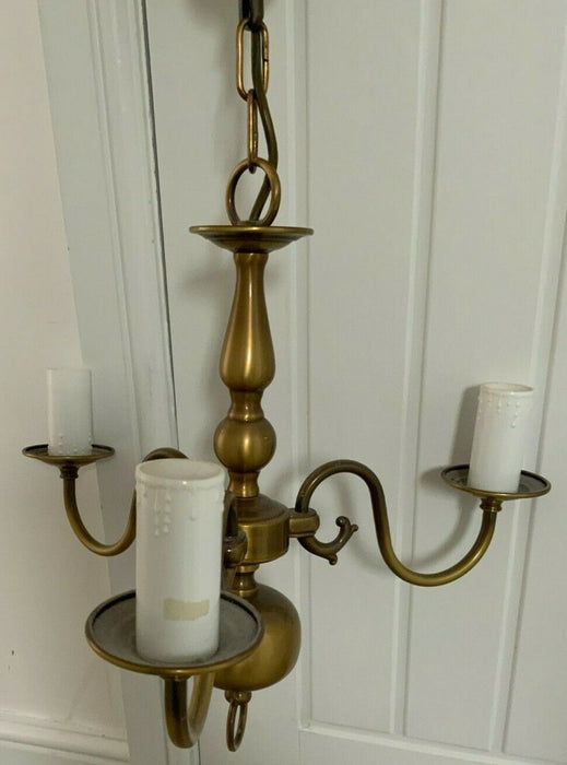 Brass pendant light with candle sleeves