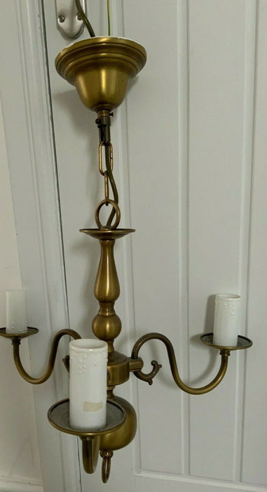 Brass pendant light with candle sleeves