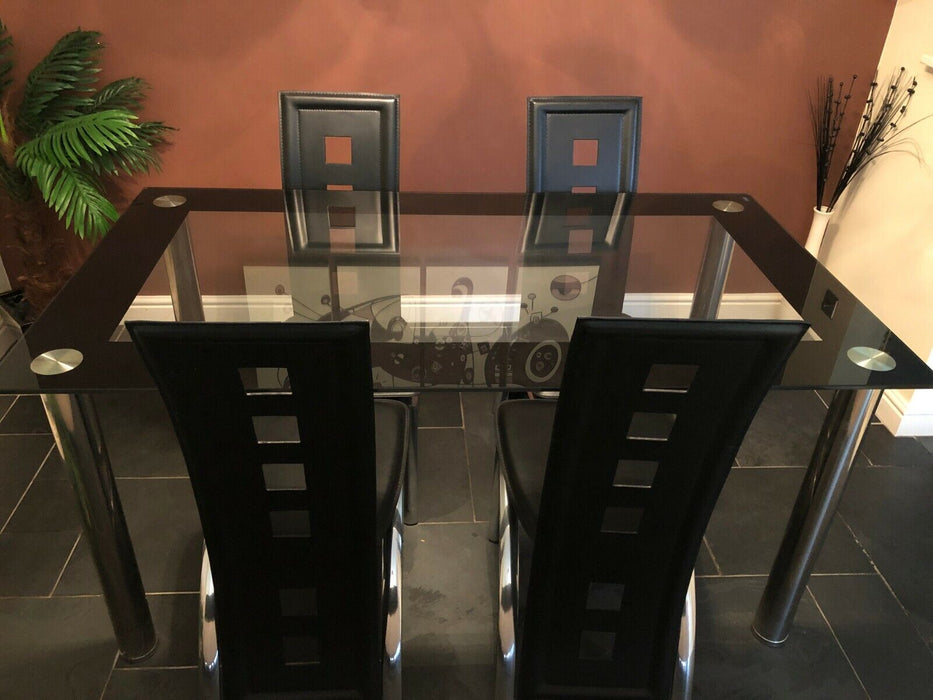 Black glass dining table and four chairs